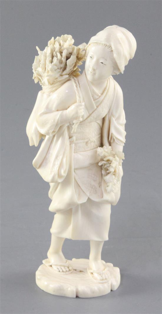 A Japanese ivory figure of a female peasant, Meiji period, height 17.5cm